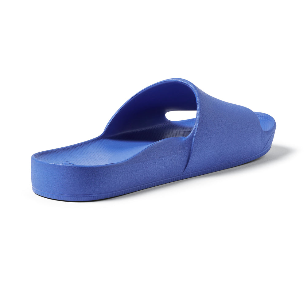 Royal Blue Arch support slides left shoe back 3/4 angle studio image 